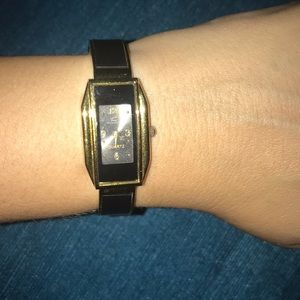 Black and gold cuff bracelet watch